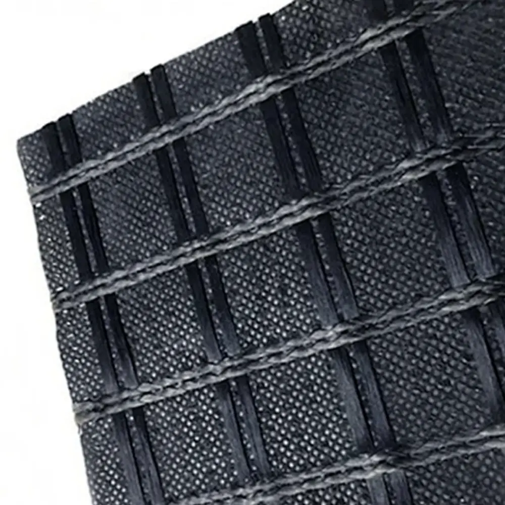 Geomalla de poliéster con geotextil adherido